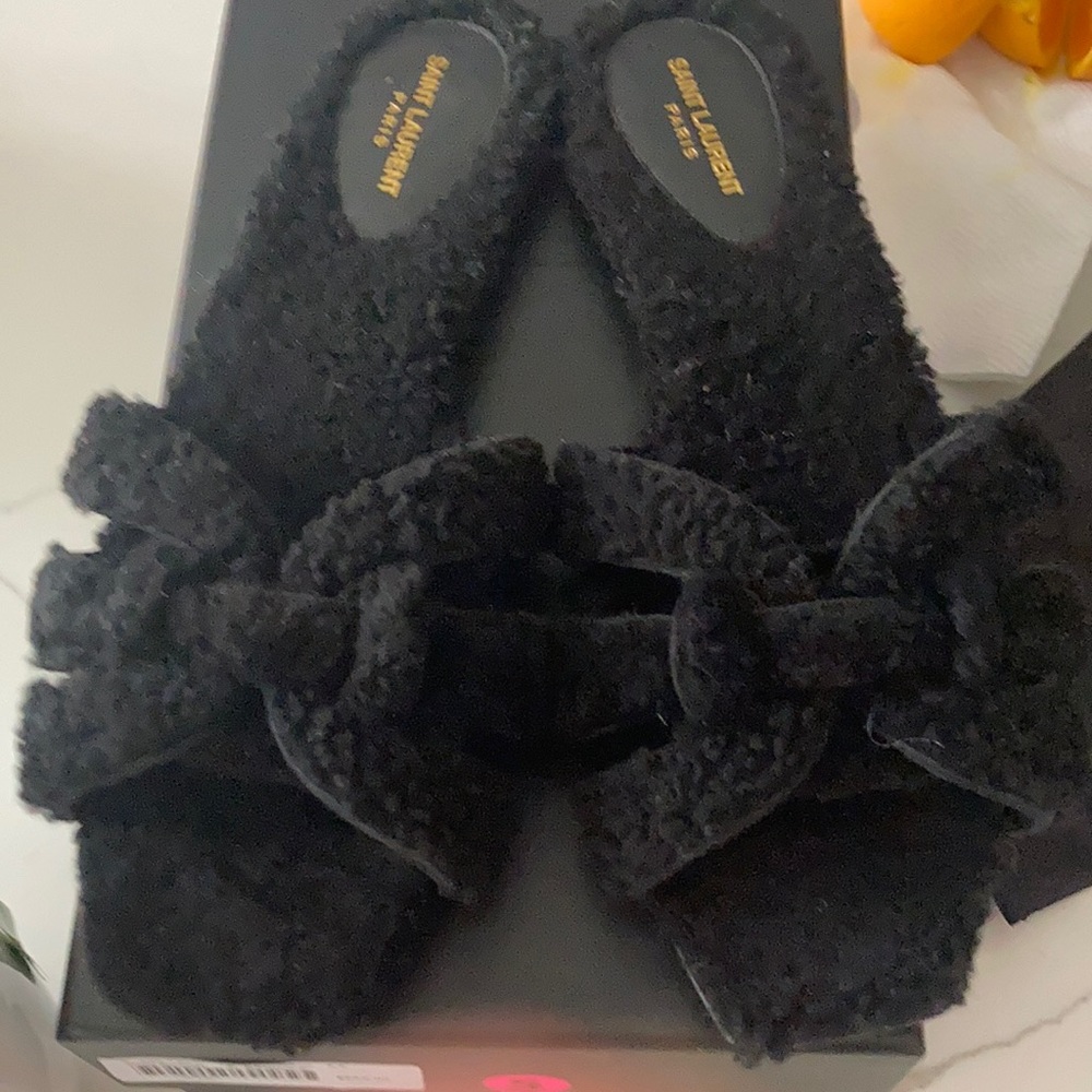Saint laurent black shearling slides.  Worn twice. In perfect mint condition.